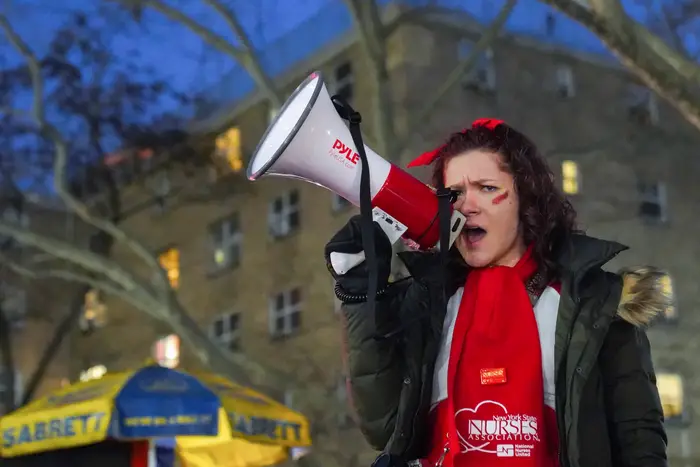 A nurse speaks to the megaphone during a strike at two of New York City's biggest hospitals, Jan. 11, 2023.